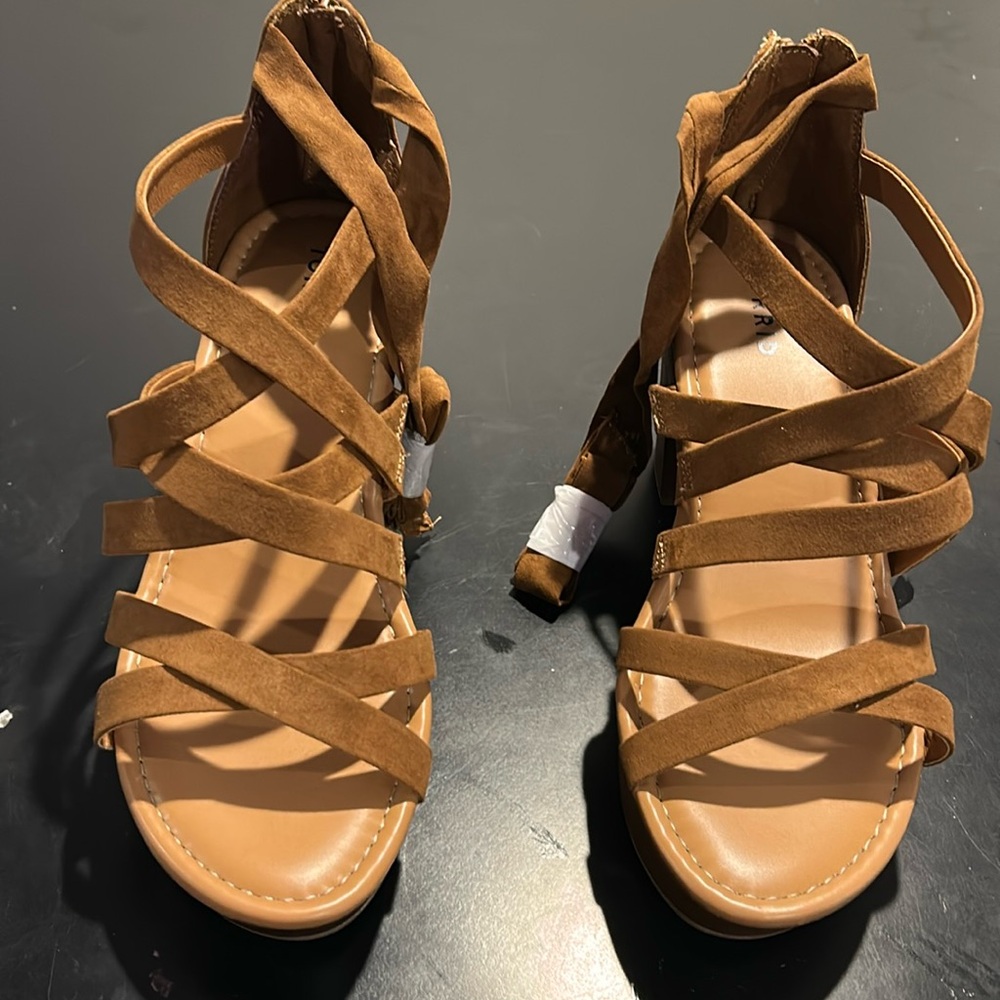 Torrid Sandals that strap around the legs.